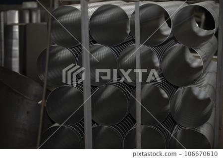 Metal stainless ventilation pipes at a metallurgical plant. Rolled metal. 106670610