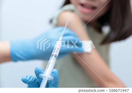 Elementary school girl giving an injection at the hospital Elementary school girl giving an injection at the hospital 106671947