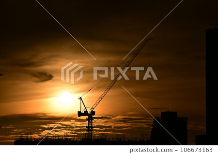 Dusk, construction cranes floating in the orange evening sky, Kaohsiung City, Southern Taiwan, Dusk, construction cranes floating in the orange evening sky, Kaohsiung City, Southern Taiwan, 106673163