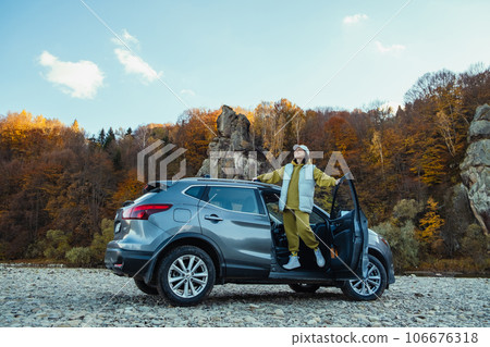 happy woman car traveler at rocky river beach 106676318