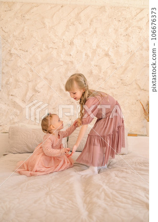 two cute sisters portrait two cute sisters portrait 106676373