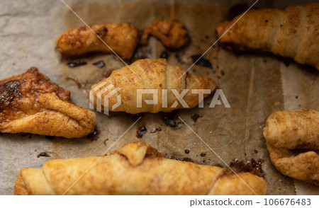 home made pastry on a baking paper in a tray home made pastry on a baking paper in a tray 106676483
