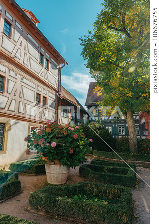 Beautiful Garden and Old National German Half-Timbered houses Town House in Bietigheim-Bissingen, Baden-Wuerttemberg, Germany, Europe. Old Town is full of colorful and well preserved buildings. 106676755