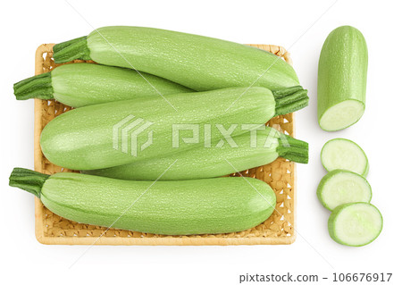 zucchini or marrow in a wicker basket isolated on white background with full depth of field. Top view. Flat lay 106676917