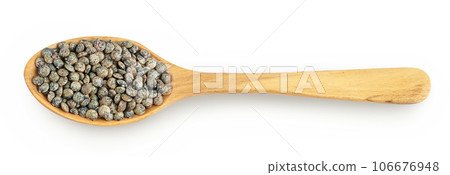 raw french green lentils in wooden spoon isolated on white background. Top view. Flat lay 106676948