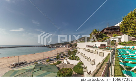 Panorama showing the coastline of the village of Sesimbra timelapse. Portugal Panorama showing the coastline of the village of Sesimbra timelapse. Portugal 106677392