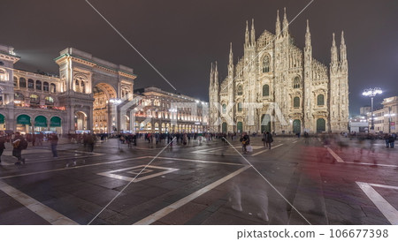 Panorama showing Milan Cathedral and Vittorio Emanuele gallery night timelapse. Panorama showing Milan Cathedral and Vittorio Emanuele gallery night timelapse. 106677398