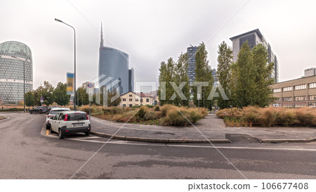 Panorama showing skyscrapers and towers from park with green lawn timelapse in Milan Panorama showing skyscrapers and towers from park with green lawn timelapse in Milan 106677408