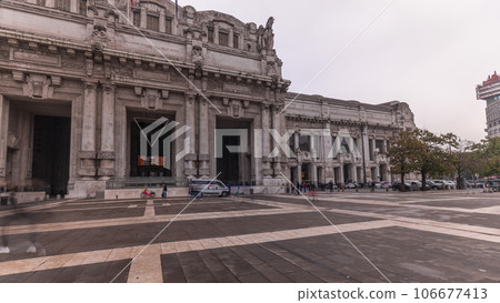 Panorama showing Milano Centrale timelapse - the main central railway station of the city of Milan in Italy. Panorama showing Milano Centrale timelapse - the main central railway station of the city of Milan in Italy. 106677413