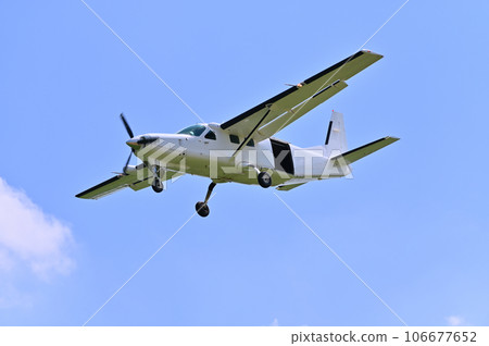 Light aircraft flying in the sky Light aircraft flying in the sky 106677652