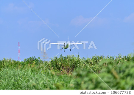 Light aircraft taking off and landing 106677728