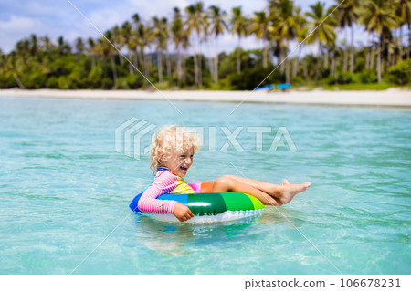 Child on tropical beach. Sea vacation with kids. Child on tropical beach. Sea vacation with kids. 106678231