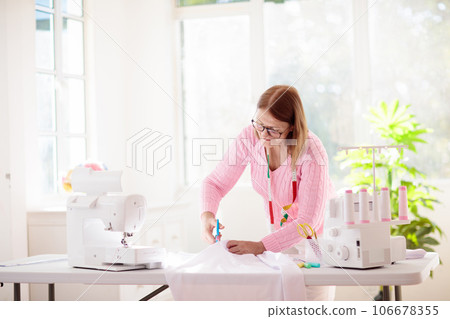Sewing machine. Fashion design workshop. 106678355