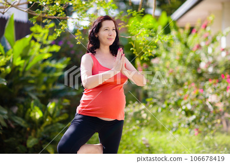 Pregnancy yoga. Exercise for pregnant woman. Pregnancy yoga. Exercise for pregnant woman. 106678419