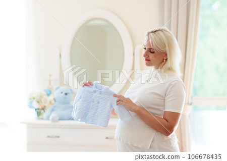 Pregnant woman at home. Young expecting mother. 106678435
