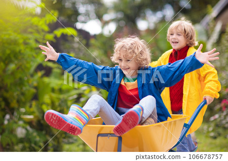 Kids on pumpkin patch. Child autumn outdoor fun. 106678757