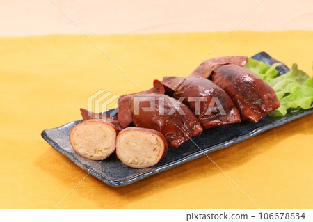 Ikameshi - sticky rice stuffed inside squid - meal Ikameshi - sticky rice stuffed inside squid - meal 106678834