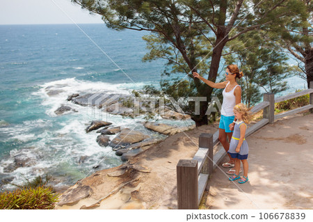 Family hiking. Mountain sea view. Travel with kids Family hiking. Mountain sea view. Travel with kids 106678839