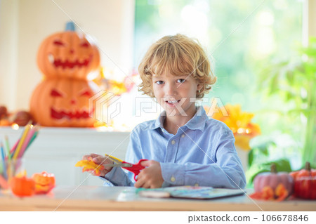 Family decorating home. Halloween arts and crafts. 106678846