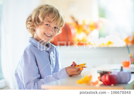 Family decorating home. Halloween arts and crafts. Family decorating home. Halloween arts and crafts. 106678848