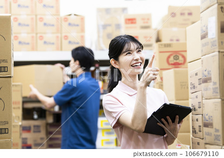 A woman working in a warehouse A woman working in a warehouse 106679110