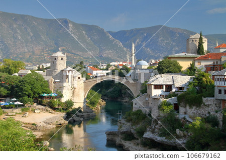 Mostar, Bosnia-Herzegovina, Southern Europe, Stari Most, a World Cultural Heritage bridge over the Neretva River, and a view of the mountains 106679162