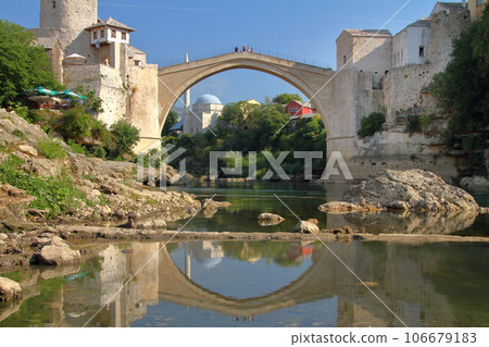 Stari Most, a world cultural heritage bridge spanning the Neretva River in Mostar, Bosnia and Herzegovina, southern Europe, and the water mirror on the river surface Stari Most, a world cultural heritage bridge spanning the Neretva River in Mostar, Bosnia and Herzegovina, southern Europe, and the water mirror on the river surface 106679183