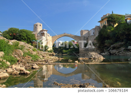 Stari Most, a world cultural heritage bridge spanning the Neretva River in Mostar, Bosnia and Herzegovina, southern Europe, and the water mirror on the river surface Stari Most, a world cultural heritage bridge spanning the Neretva River in Mostar, Bosnia and Herzegovina, southern Europe, and the water mirror on the river surface 106679184