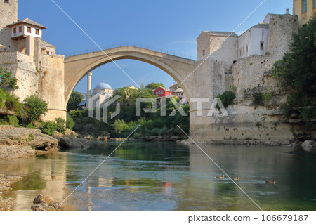 Stari Most, a world cultural heritage bridge spanning the Neretva River in Mostar, Bosnia and Herzegovina, southern Europe, and the water mirror on the river surface Stari Most, a world cultural heritage bridge spanning the Neretva River in Mostar, Bosnia and Herzegovina, southern Europe, and the water mirror on the river surface 106679187