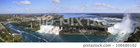 Panoramic aerial view of Rainbow Bridge, American Falls, Bridal Veil Falls and Horseshoe Falls known as Niagara Falls 106680182