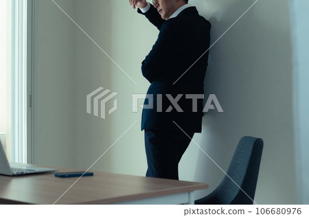 An agonizing businessman An agonizing businessman 106680976
