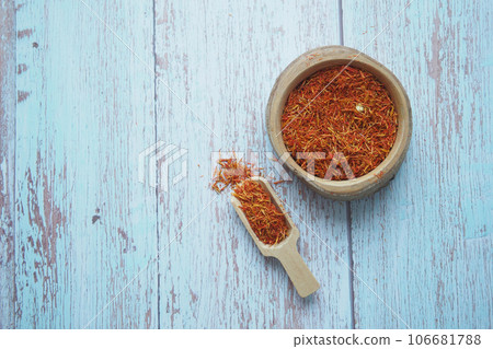 chili flakes in a bowl on table chili flakes in a bowl on table 106681788
