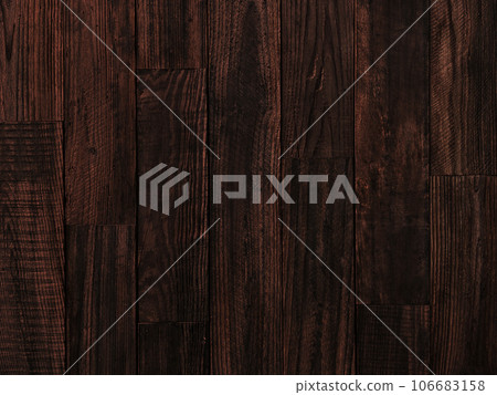 Horizontal background image 2 of an old plank wall made of dark brown coarse-grained lumber Horizontal background image 2 of an old plank wall made of dark brown coarse-grained lumber 106683158