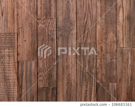 Horizontal background image 2 of an old plank wall made of brown coarse-grained lumber Horizontal background image 2 of an old plank wall made of brown coarse-grained lumber 106683161