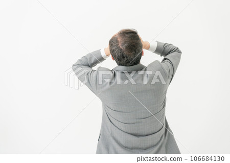 Worried businessman back view Worried businessman back view 106684130