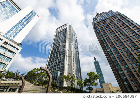 Low angle view of Taipei 101 skyscrapers in Taipei, Taiwan. The Xinyi District is Taipei's main shopping area, anchored by several department stores and malls. Low angle view of Taipei 101 skyscrapers in Taipei, Taiwan. The Xinyi District is Taipei's main shopping area, anchored by several department stores and malls. 106684387