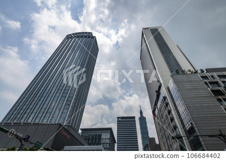 Low angle view of the plaza in Xinyi Business District, Taipei, Taiwan. the District is Taipei's main shopping area, anchored by various department stores and malls. Low angle view of the plaza in Xinyi Business District, Taipei, Taiwan. the District is Taipei's main shopping area, anchored by various department stores and malls. 106684402