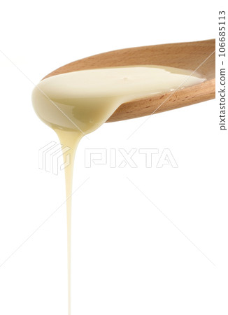 pouring condensed milk 106685113