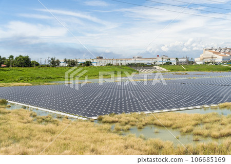 View of the floating Solar power system on the flood detention basin in Kaohsiung, Taiwan. View of the floating Solar power system on the flood detention basin in Kaohsiung, Taiwan. 106685169