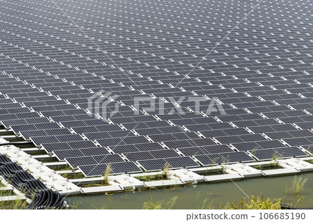 View of the floating Solar power system on the flood detention basin in Kaohsiung, Taiwan. View of the floating Solar power system on the flood detention basin in Kaohsiung, Taiwan. 106685190