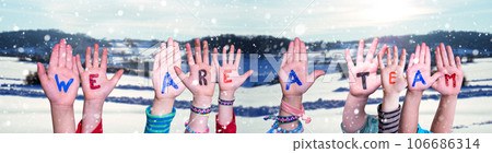 Children Hands Building Word We Are A Team, Winter Background. 106686314