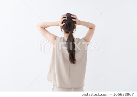 A woman holding a head A woman holding a head 106688967