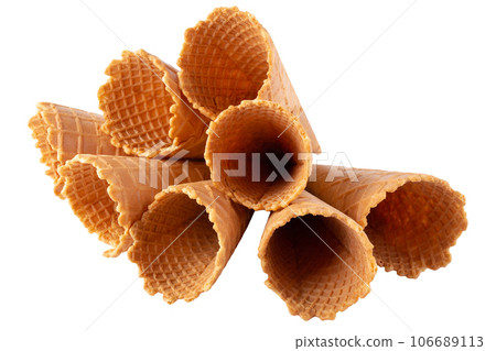 waffle ice-cream cone isolated over white background. waffle ice-cream cone isolated over white background. 106689113