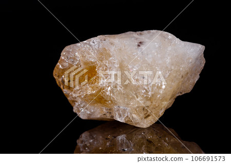 Macro mineral stone Citrine on black background Macro mineral stone Citrine on black background 106691573