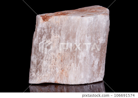Macro mineral stone red gypsum on black background 106691574