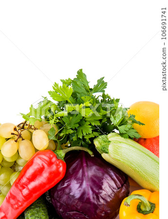 Set of fruits and vegetables isolated on white . Free space for text. Vertical photo. Set of fruits and vegetables isolated on white . Free space for text. Vertical photo. 106691741