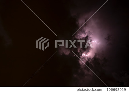 Ray. Storm. The sky is full of dark clouds in bad weather before a big storm rain. Light emission from the Edge of clouds. Zoom the surface of a Black haze at close range. Ray. Storm. The sky is full of dark clouds in bad weather before a big storm rain. Light emission from the Edge of clouds. Zoom the surface of a Black haze at close range. 106692939