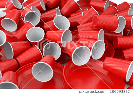 Heap of disposable utensils like plate, folk, spoon,knife and cup on white. 106693882