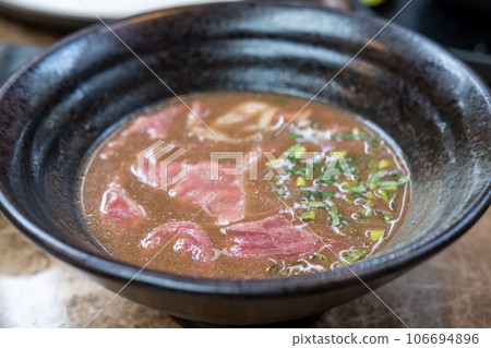 Thai noodle with rare sliced wagyu meat in blood soup Thai noodle with rare sliced wagyu meat in blood soup 106694896