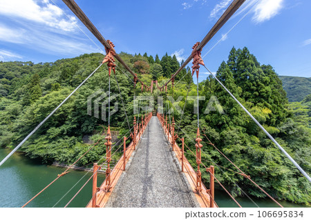 Wagatani Suspension Bridge, across Daishoji River, Kaga, Ishikawa, Japan. 106695834